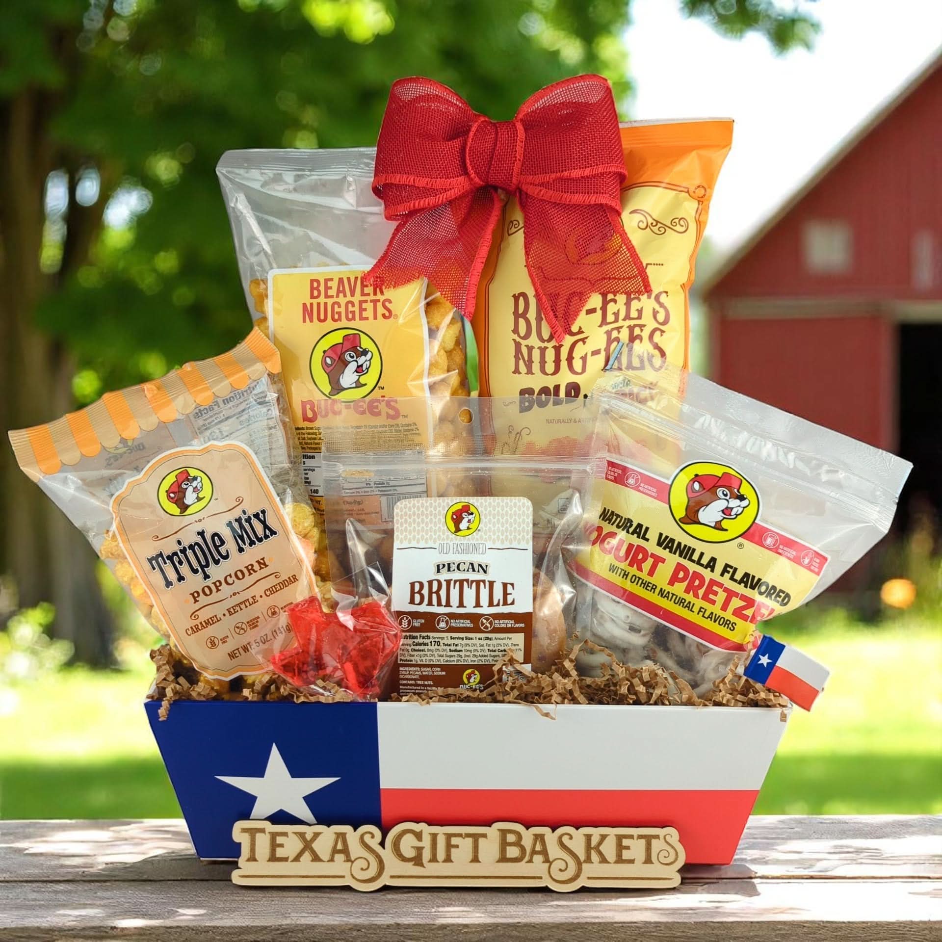 a texas themed snack gift featuring buc-ees snacks on a texas flag market tray