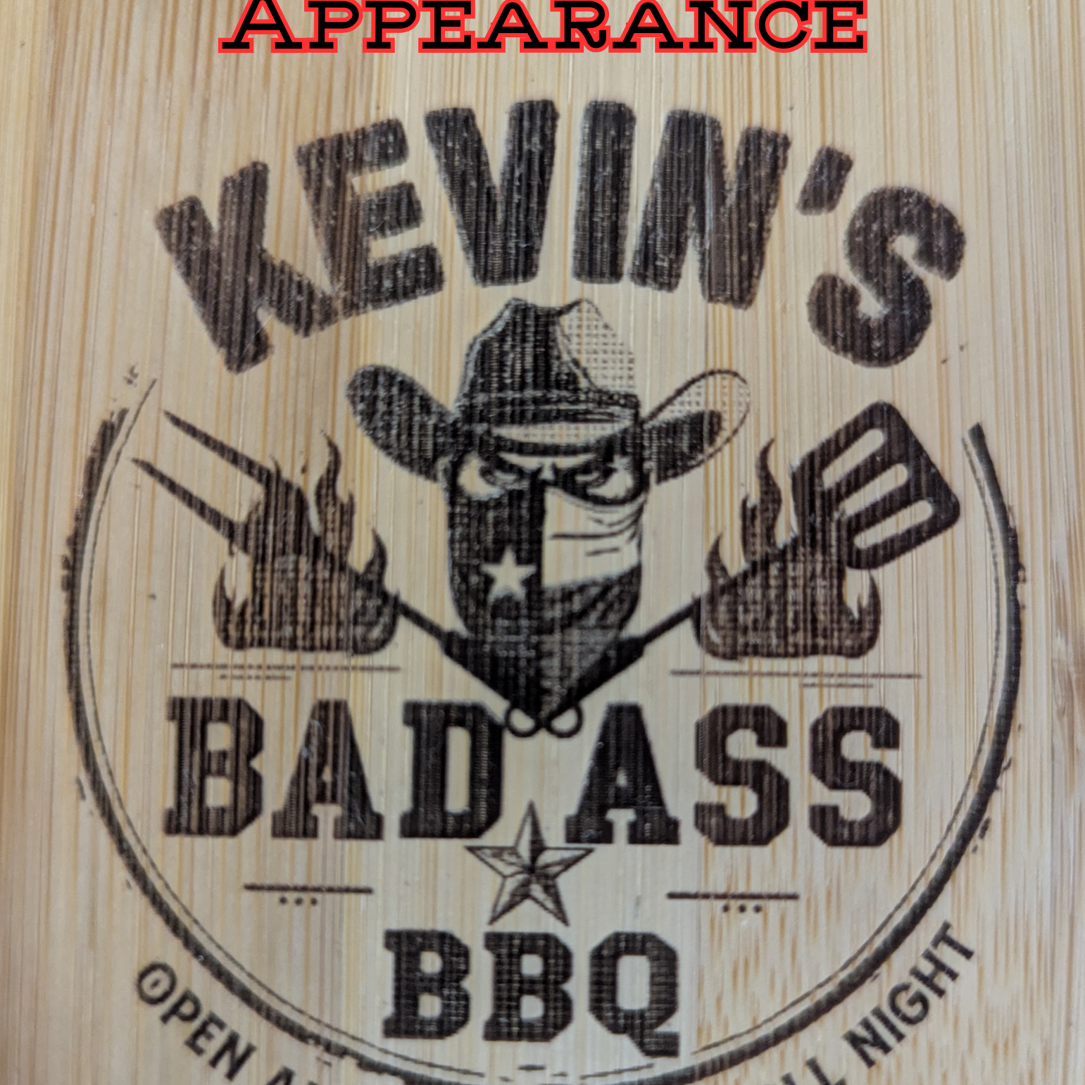 Close-up of custom engraving on wooden BBQ grill scraper with bottle opener from The Texas Gift Company