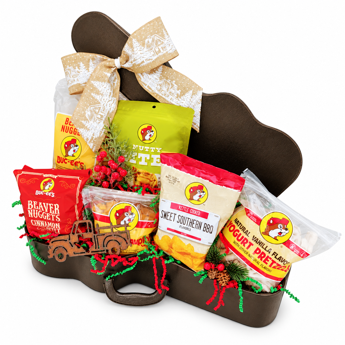 Buc-ee’s Christmas Road Trip curated guitar case gift with six snacks, a Texas truck magnet and holiday ribbon on a white background.