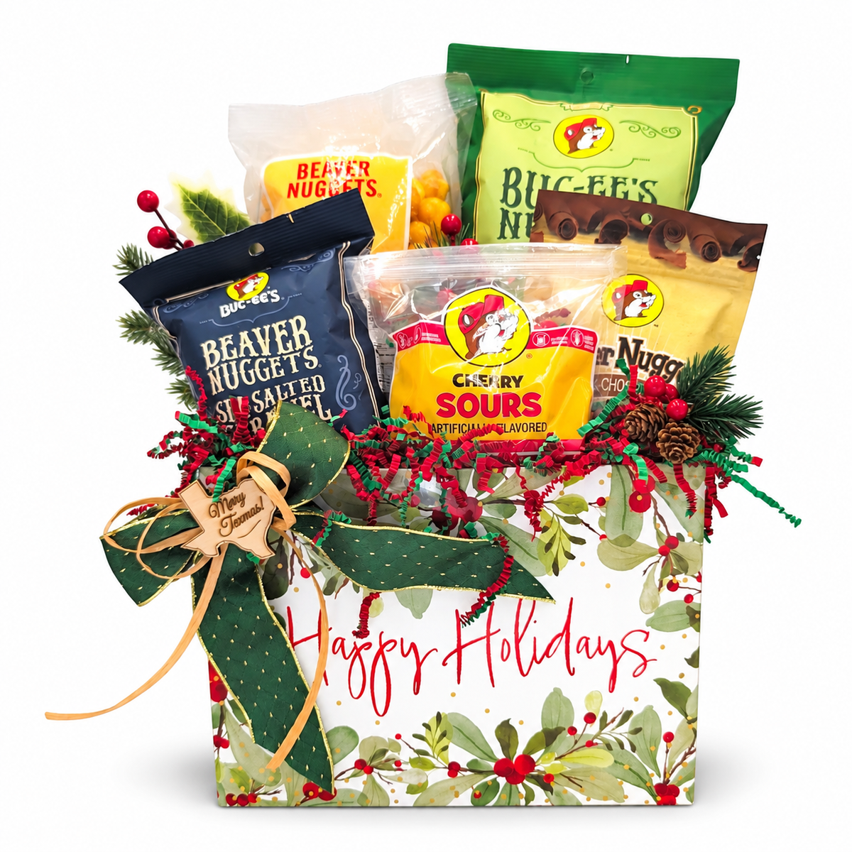 Buc-ee’s Merry Munchies Christmas Box with five snacks, Holiday Berries box and green bow on white