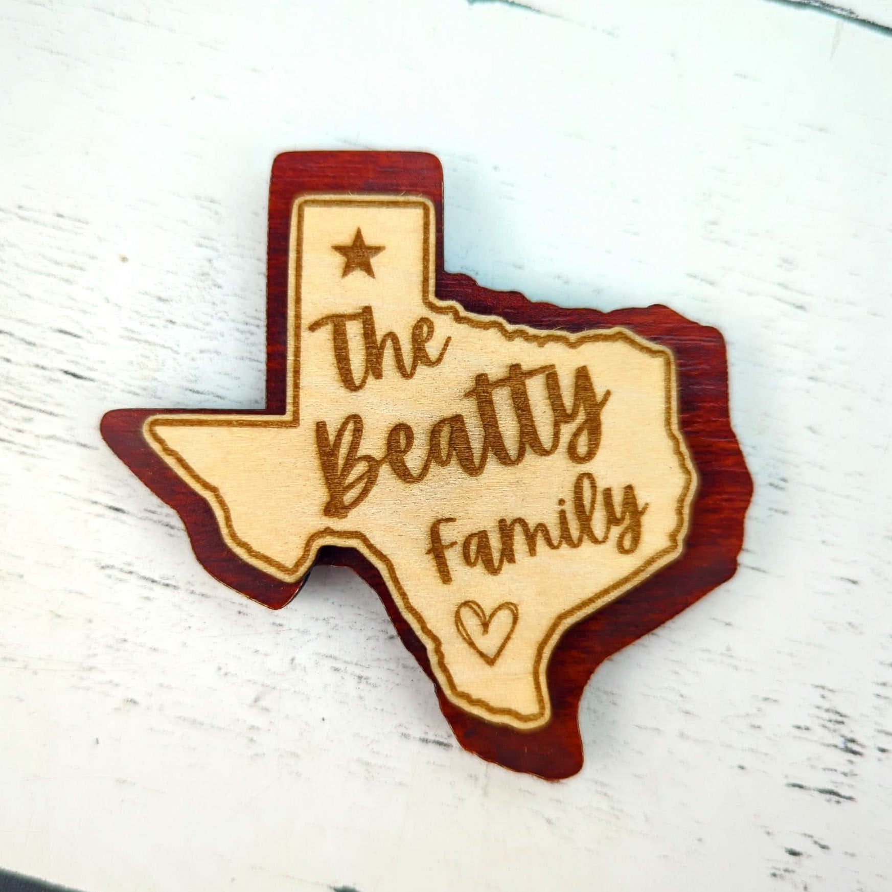 Custom engraved Texas-shaped wood magnet personalized with a family name