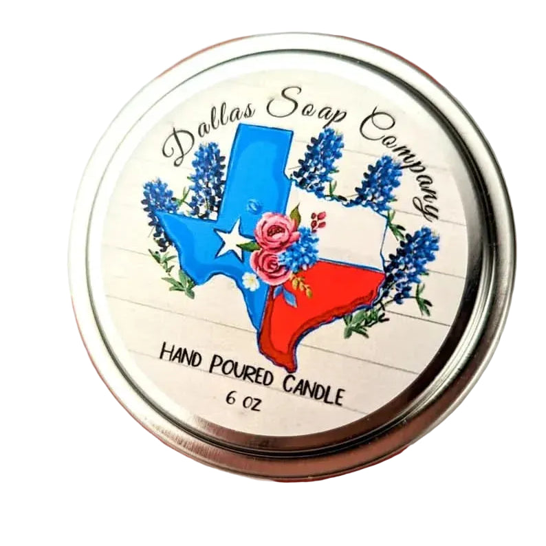 Round silver tin labeled “Dallas Soap Company” hand-poured candle with a Texas state and floral illustration, featured in a Texas artisan home fragrance gift collection.