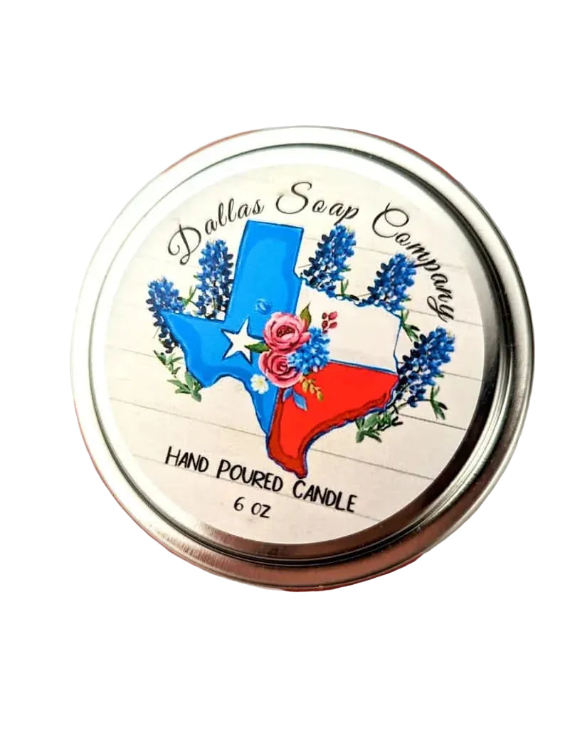Round silver tin labeled “Dallas Soap Company” hand-poured candle with a Texas state and floral illustration, featured in a Texas artisan home fragrance gift collection.