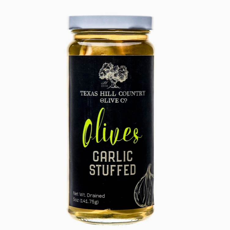 Garlic stuffed olives jar displayed as a gourmet Texas food and entertaining gift from The Texas Gift Company storefront