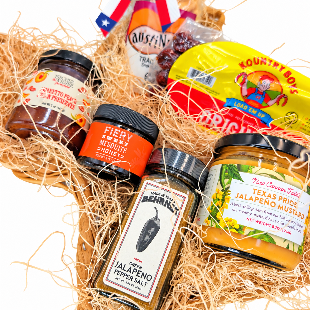 Close-up of Texas Flavor Trail’s six products and natural basket filling on a white background
