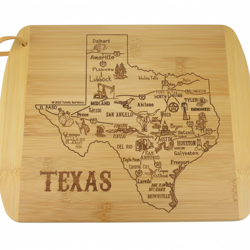Bamboo cutting board engraved with a detailed illustrated map of Texas, featuring labeled cities, regional icons, and landmarks, with the word “Texas” engraved below, displayed on a light rustic wooden surface.