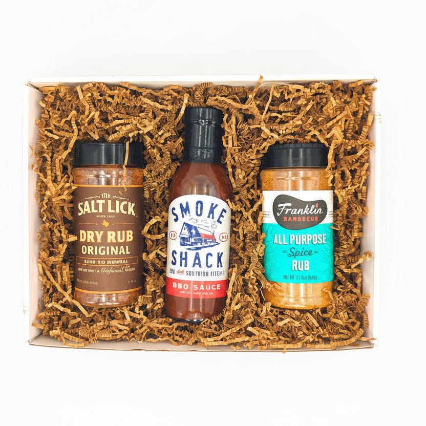 Texas Pitmaster Christmas Trio gift set with barbecue sauces and seasonings arranged for holiday gifting