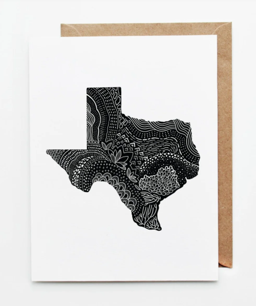 Minimalist white greeting card featuring a black hand-drawn Texas state silhouette filled with intricate line art patterns, shown with a kraft paper envelope