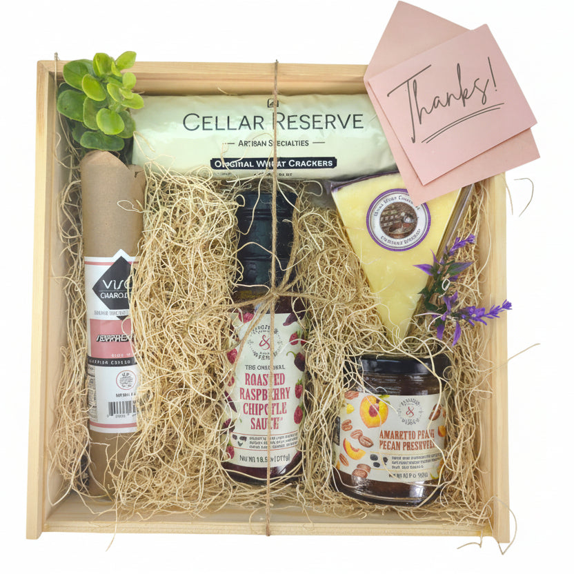 The Grateful Graze Box filled with assorted Texas-inspired treats displayed as a thank-you gift