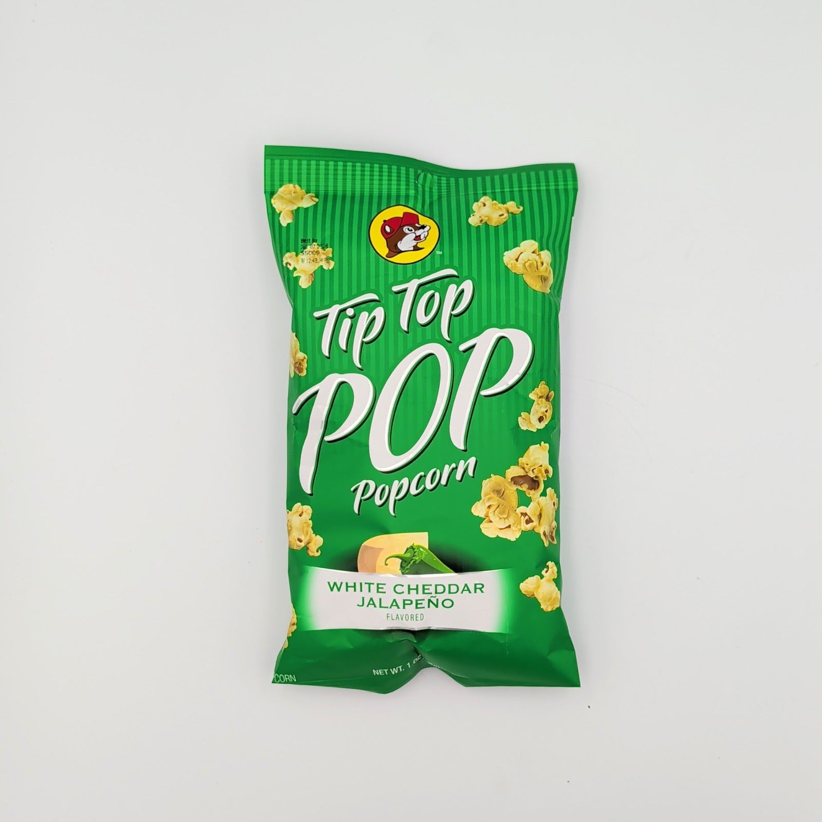 Tip Top Pop white cheddar jalapeño popcorn displayed in a bowl as part of a Texas snack gift assortment from The Texas Gift Company storefront
