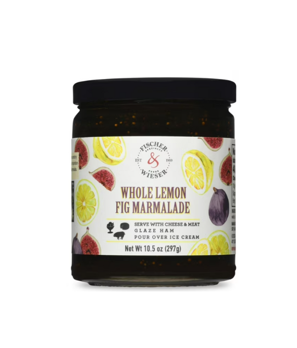 Glass jar of Fischer & Wieser whole lemon fig marmalade with a black lid, featuring a colorful label with lemons and figs, shown on a clean white background as a gourmet fruit spread.