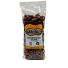 Clear bag of AustiNuts cinnamon sugar pecans, dry roasted, 4 oz package with visible pecans and front label