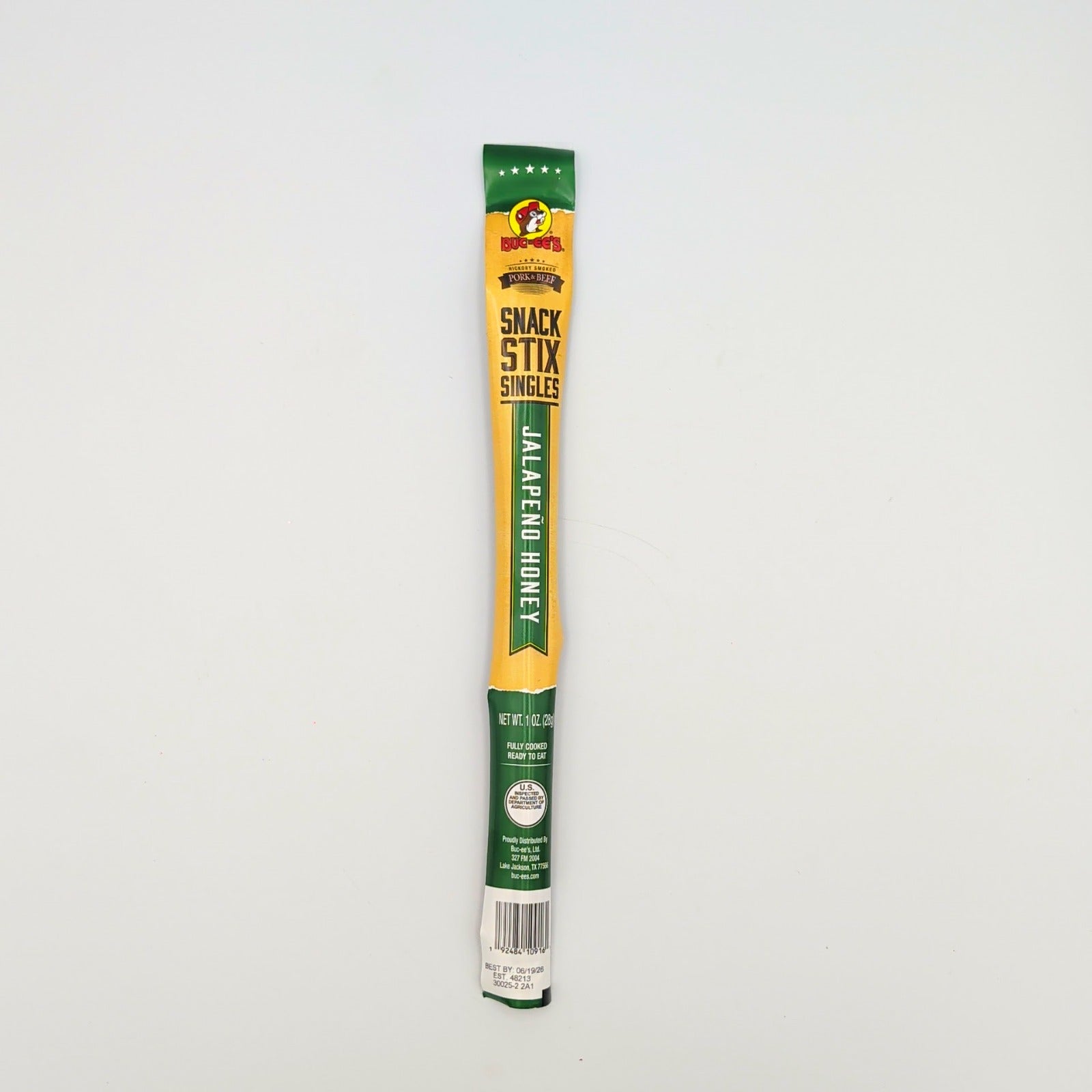 Buc-ee’s jalapeño honey beef stick shown in close-up as a bold Texas snack item from The Texas Gift Company storefront