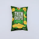 Buc-ee’s jalapeño thin chips shown in a snack bowl as part of a Texas snack gift assortment from The Texas Gift Company storefront