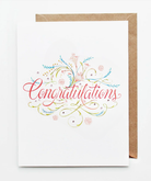 Elegant Congratulations graduation card with colorful floral accents and hand-lettered script.