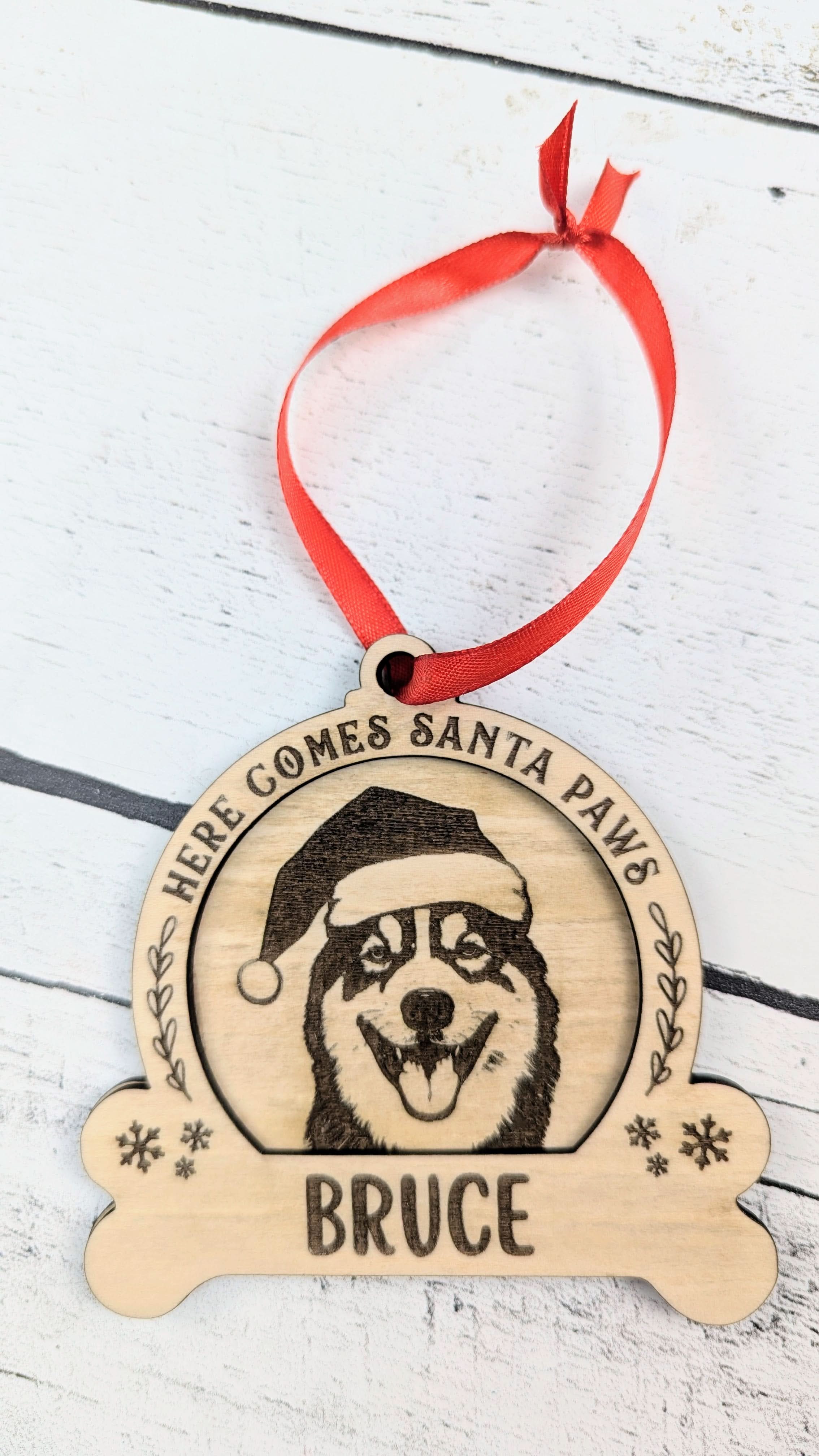 Custom dog breed Christmas ornament personalized with a pet’s name displayed as a heartfelt Texas keepsake from The Texas Gift Company storefront
