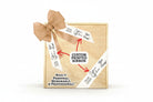 Wooden gift box displayed with a burlap bow and custom printed ribbons showing logo and signature design options, highlighted with arrows and text emphasizing personalized, professional gift packaging.