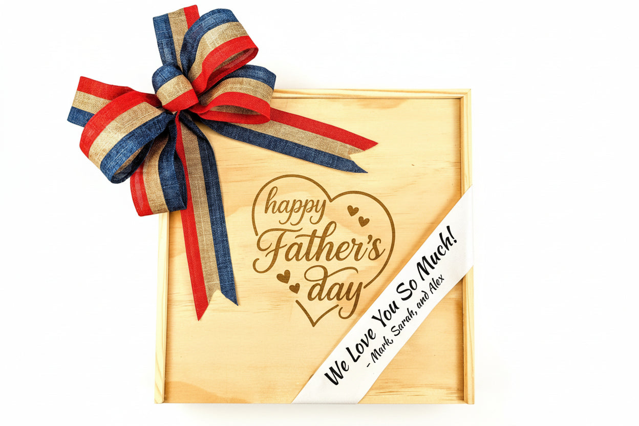 Personalized wooden gift box engraved with “Happy Father’s Day,” decorated with a red, blue, and gold ribbon bow and a custom message ribbon reading “We Love You So Much,” presented as a Father’s Day gift.