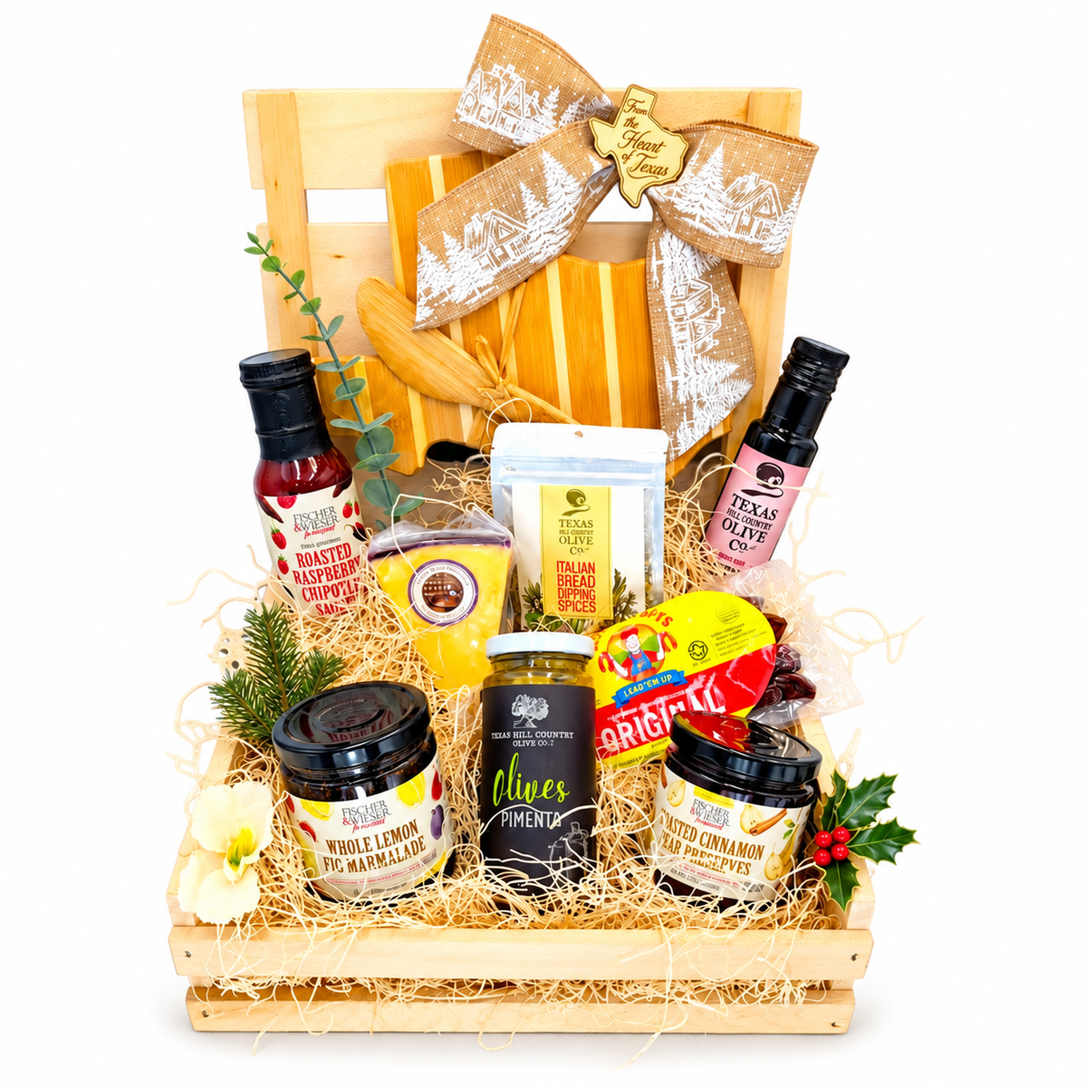 Hill Country Holiday Pantry gift in a wood crate with holiday ribbon on a white background