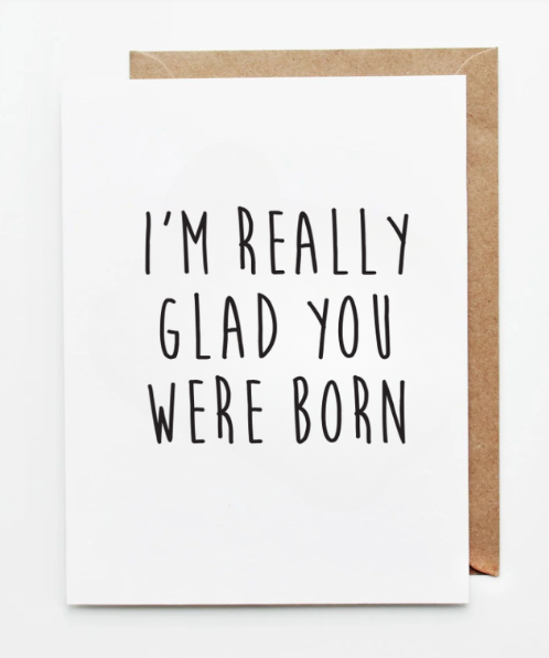 Minimalist greeting card with bold black typography reading “I’m really glad you were born” on a white background.