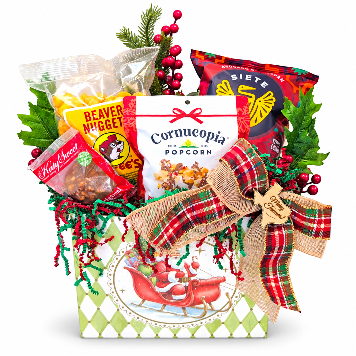 Santa’s Sweet Texas Quartet with Beaver Nuggets, BBQ chips, peppermint bark popcorn and pecan praline in a Santa box on white.
