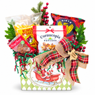 Santa’s Sweet Texas Quartet with Beaver Nuggets, BBQ chips, peppermint bark popcorn and pecan praline in a Santa box on white.