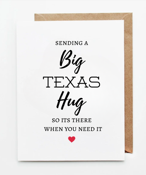 “White greeting card with the message ‘Sending a Big Texas Hug so it’s there when you need it,’ featuring modern typography and a small red heart, paired with a kraft paper envelope.”