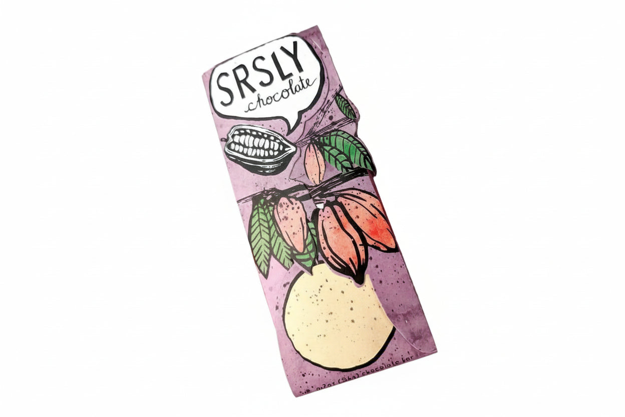 Illustrated “Srsly Chocolate” artisan chocolate bar wrapper with cacao pod artwork and pastel purple background, featured in a Texas craft chocolate and sweets gift collection.