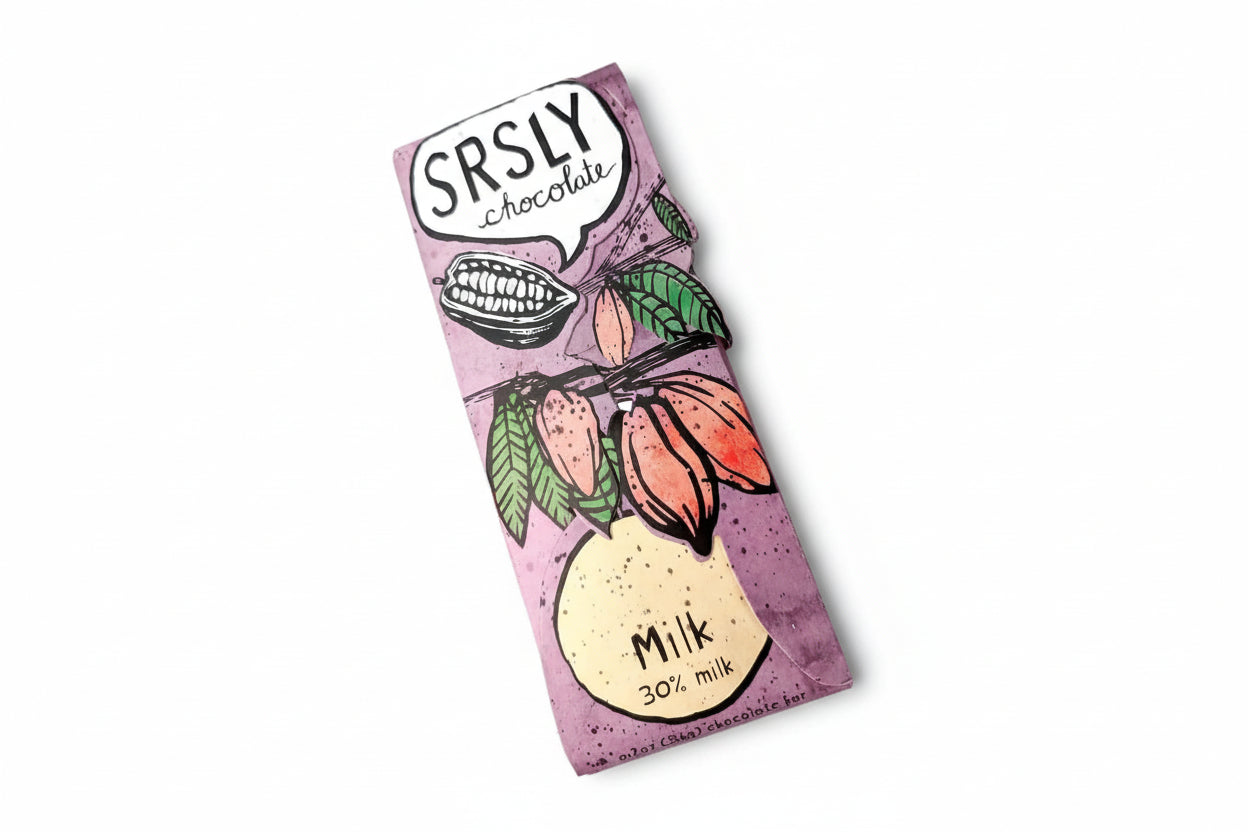 SRSLY Chocolate milk chocolate bar in illustrated purple packaging featuring cacao pods and leaves, labeled 30% milk chocolate on a white background.