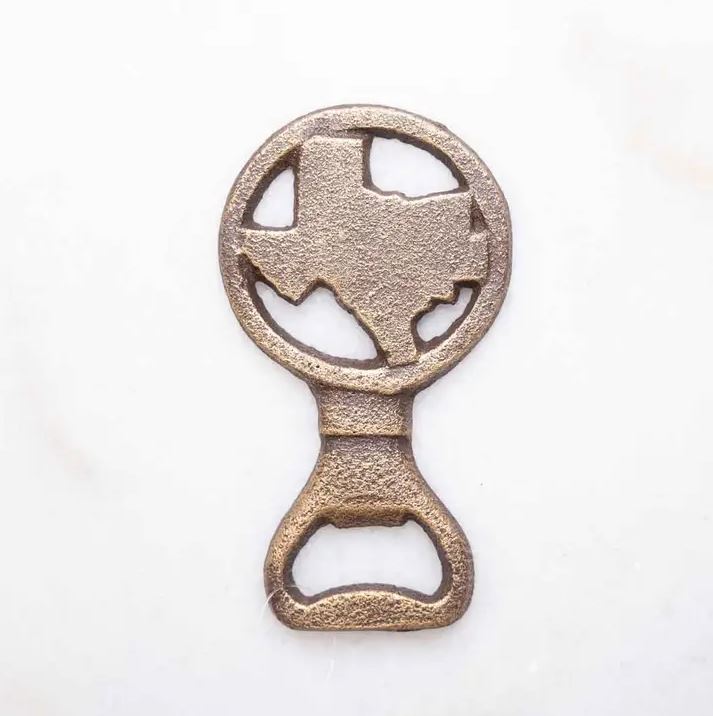 Antique gold Texas-shaped bottle opener displayed as a rustic Texas bar accessory gift from The Texas Gift Company storefront