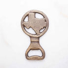 Antique gold Texas-shaped bottle opener displayed as a rustic Texas bar accessory gift from The Texas Gift Company storefront