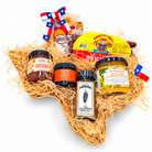 Texas Flavor Trail’s six Texas favorites in a Texas-shaped wicker basket on a white background