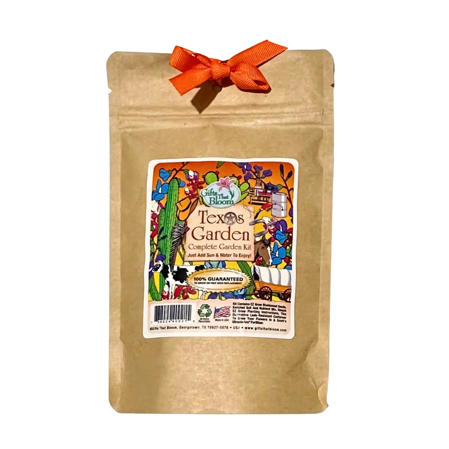 Texas Garden complete planting kit in a kraft paper gift bag with an orange ribbon, featuring a colorful label with Texas-themed illustrations and “Just add sun and water” gardening instructions.