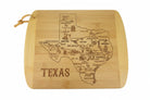 Bamboo cutting board engraved with a detailed illustrated map of Texas, featuring labeled cities, regional icons, and landmarks, with the word “Texas” engraved below, displayed on a light rustic wooden surface.