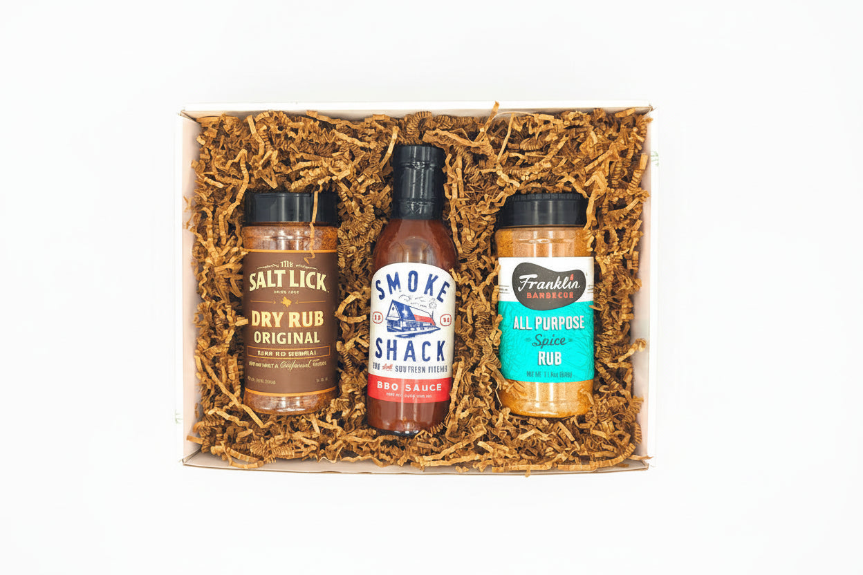 Texas Pitmaster Christmas Trio gift set with barbecue sauces and seasonings arranged for holiday gifting