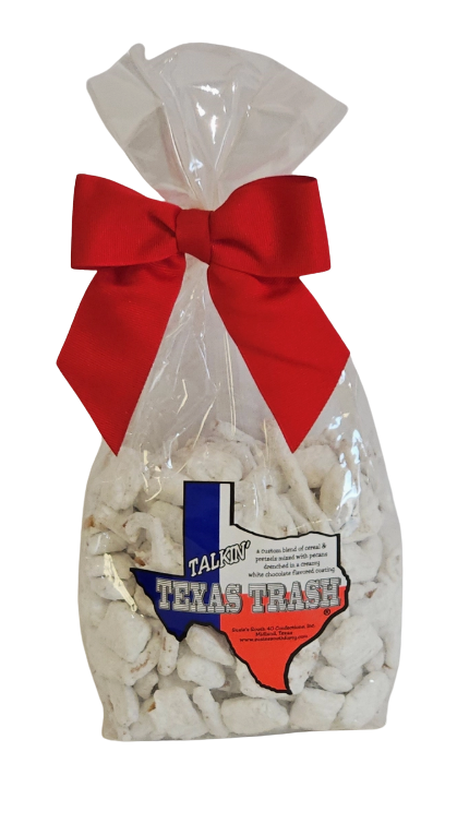 Clear gift bag filled with white popcorn labeled “Texas Trash,” tied with a large red ribbon bow, displayed on a white background as a Texas-themed snack gift.